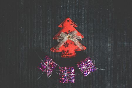 Beautiful Christmas toys to decorate the holiday on a black surfaceの写真素材