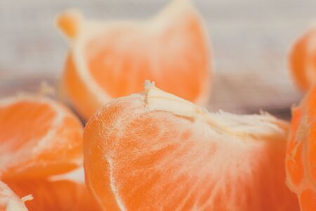 Sweet tangerines for the New Year lie on a white wooden table.の写真素材