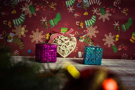 Christmas toys to decorate the holiday tree on a wooden white tableの写真素材