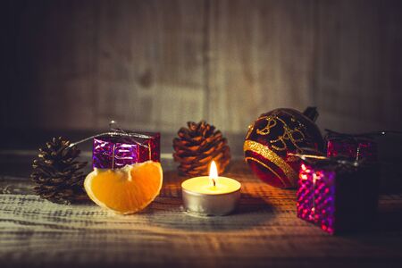 Christmas toys to decorate the holiday tree on a wooden white tableの写真素材