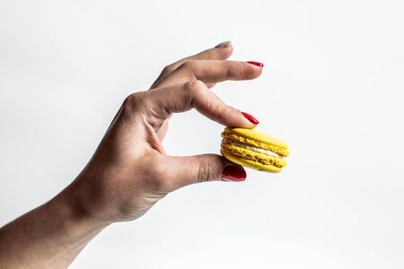 Sweet and tender cookies of different colors macaroons on a white background