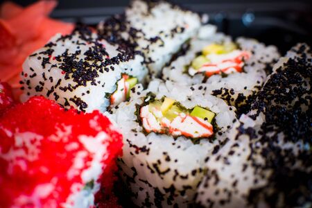 Different Asian sushi with dark wasabi sauce and wasabiの写真素材