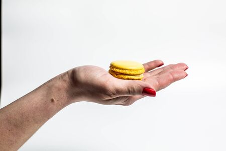 Sweet and tender cookies of different colors macaroons on a white background