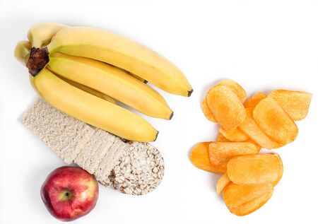 Harmful potato chips and healthy weight loss products on a white backgroundの写真素材
