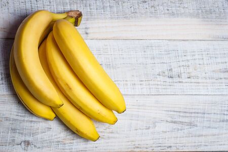 Ripe banana for diet and sports on a white wooden background closeの写真素材