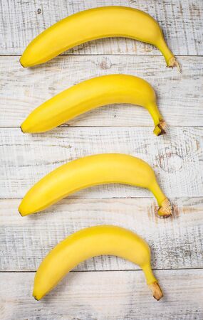 Ripe banana for diet and sports on a white wooden background closeの写真素材
