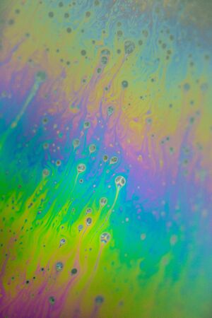 Soap bubble abstraction very close with movement and different colors