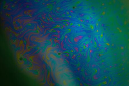 Soap bubble abstraction very close with movement and different colors