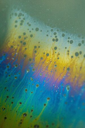Soap bubble abstraction very close with movement and different colors