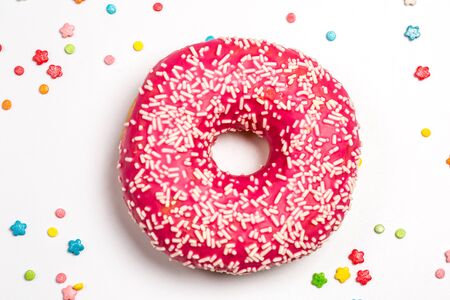 Tasty pink donut with sweet powder for the holiday on a white backgroundの写真素材