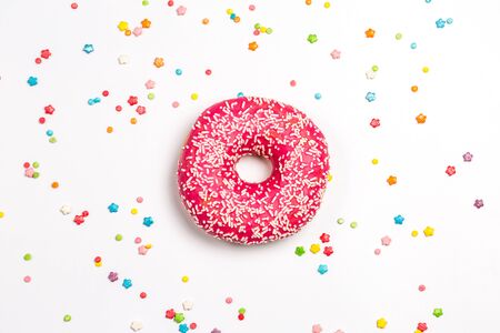 Tasty pink donut with sweet powder for the holiday on a white backgroundの写真素材