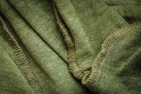 Different textured green fabric for clothes and decor