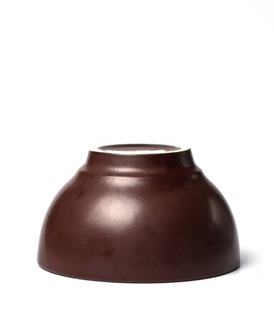 Brown deep vintage plate on a white backgroundの写真素材