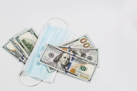 Medical mask from virus infection during a pandemic and quarantine with big money as a sign of the...