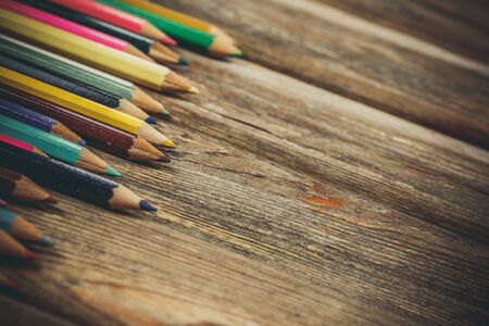 Colored pencils for drawing on a wooden backgroundの写真素材