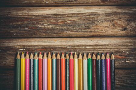 Colored pencils for drawing on a wooden backgroundの写真素材