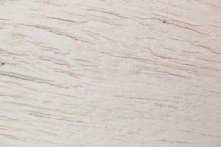 Texture of an old white painted board with scratches and cracks