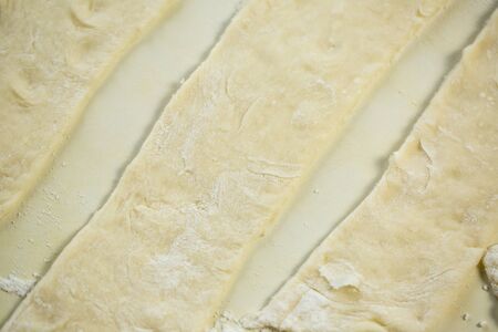 Fresh dough and flour for making pizza and dumplingsの写真素材