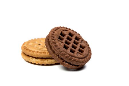 Chocolate and vanilla round cookies on a white backgroundの写真素材