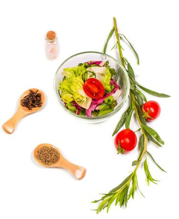 Fresh spring vegetables, salad, spices on a white backgroundの写真素材
