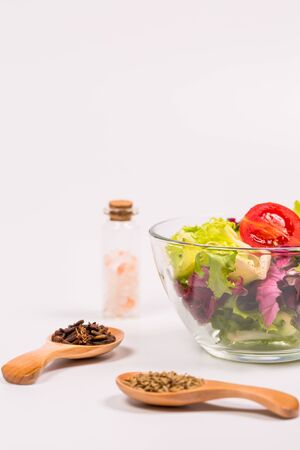 Fresh spring vegetables, salad, spices on a white backgroundの写真素材