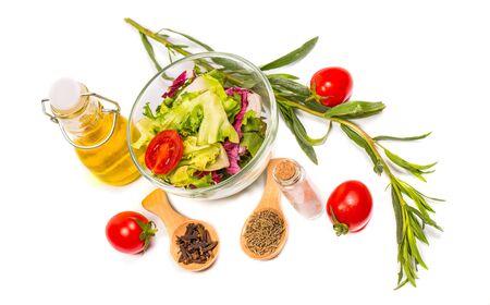 Fresh spring vegetables, salad, spices on a white backgroundの写真素材