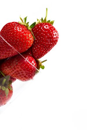 Ripe strawberries on a white background, closeの写真素材