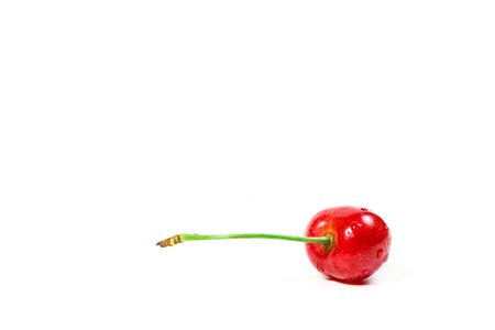 Ripe red cherries on a white backgroundの写真素材