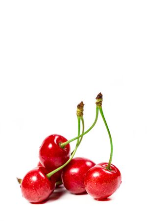 Ripe red cherries on a white backgroundの写真素材