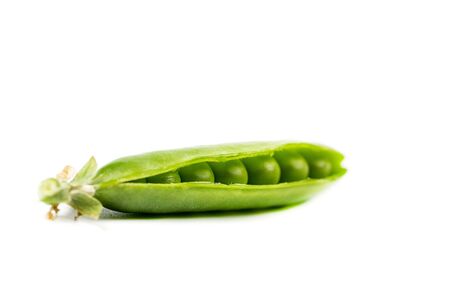 Ripe green peas on a white background, after assembly on the farmの写真素材