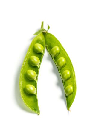 Ripe green peas on a white background, after assembly on the farmの写真素材