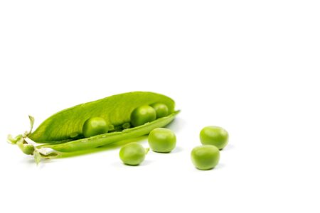 Ripe green peas on a white background, after assembly on the farmの写真素材