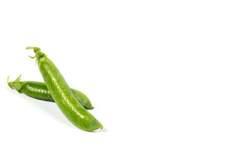 Ripe green peas on a white background, after assembly on the farmの写真素材