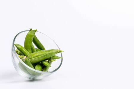 Ripe green peas on a white background, after assembly on the farmの写真素材
