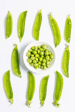 Ripe green peas on a white background, after assembly on the farmの写真素材