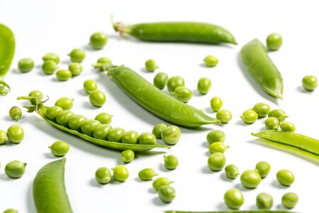 Ripe green peas on a white background, after assembly on the farm