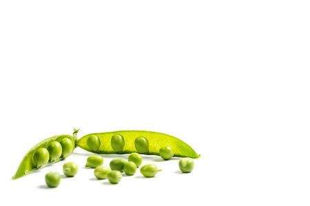 Ripe green peas on a white background, after assembly on the farmの写真素材