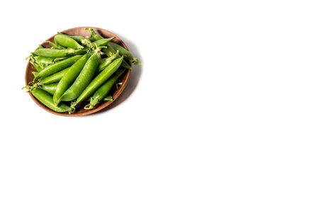 Ripe green peas on a white background, after assembly on the farmの写真素材