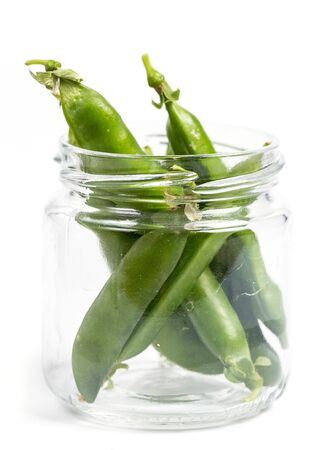 Ripe green peas on a white background, after assembly on the farmの写真素材