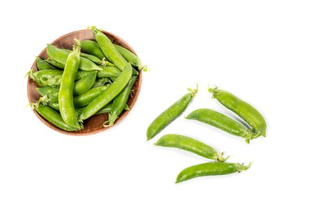Ripe green peas on a white background, after assembly on the farmの写真素材