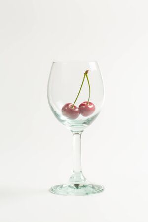 Ripe, red, sweet cherries on a white backgroundの写真素材