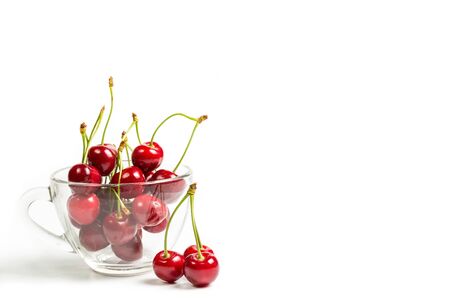 Ripe, red, sweet cherries on a white backgroundの写真素材