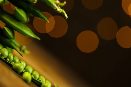 Ripe peas on a wooden table, beautiful bokeh