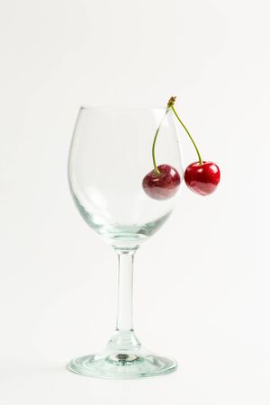 Ripe, red, sweet cherries on a white backgroundの写真素材
