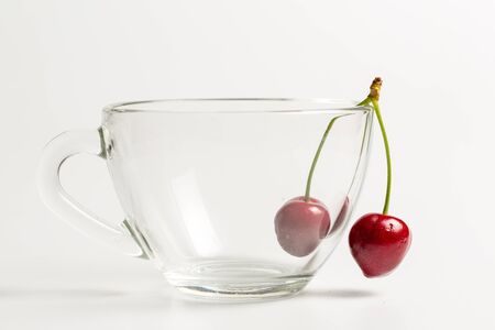 Ripe, red, sweet cherries on a white backgroundの写真素材