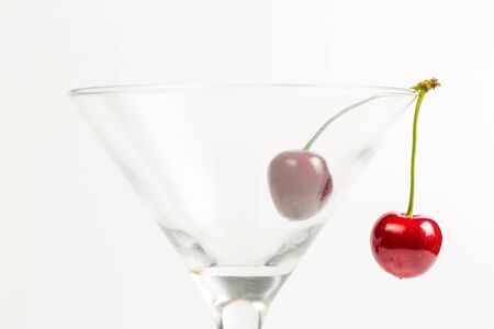 Ripe, red, sweet cherries on a white backgroundの写真素材