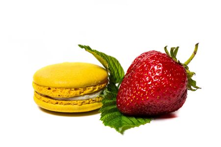 Tasty macaroon and strawberry cookies on a white backgroundの写真素材