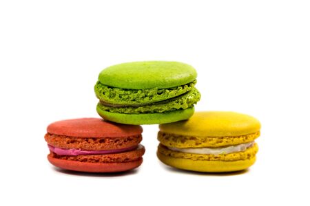 Delicious macaroon cookies of different colors on a white backgroundの写真素材