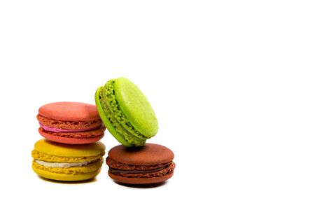 Delicious macaroon cookies of different colors on a white backgroundの写真素材