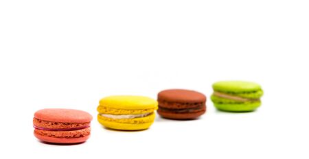 Delicious macaroon cookies of different colors on a white backgroundの写真素材